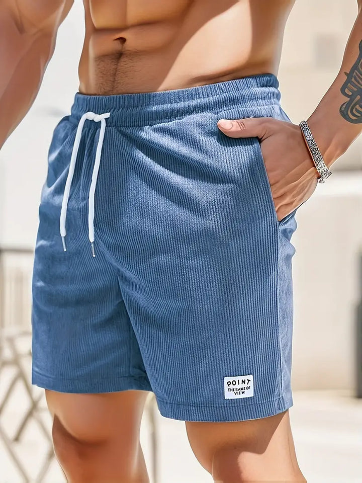 Short de bain homme coloré avec taille élastique et cordon, parfait pour la plage ou piscine, séchage rapide et élégant.