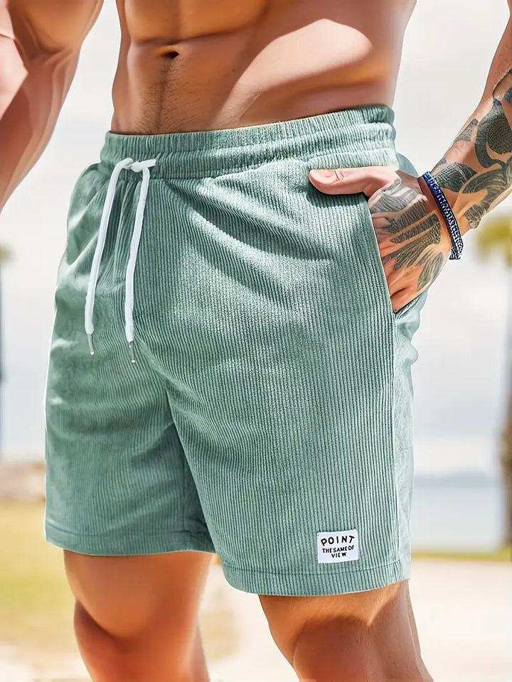 Short de bain homme coloré avec taille élastique et cordon, parfait pour la plage ou piscine, séchage rapide et élégant.