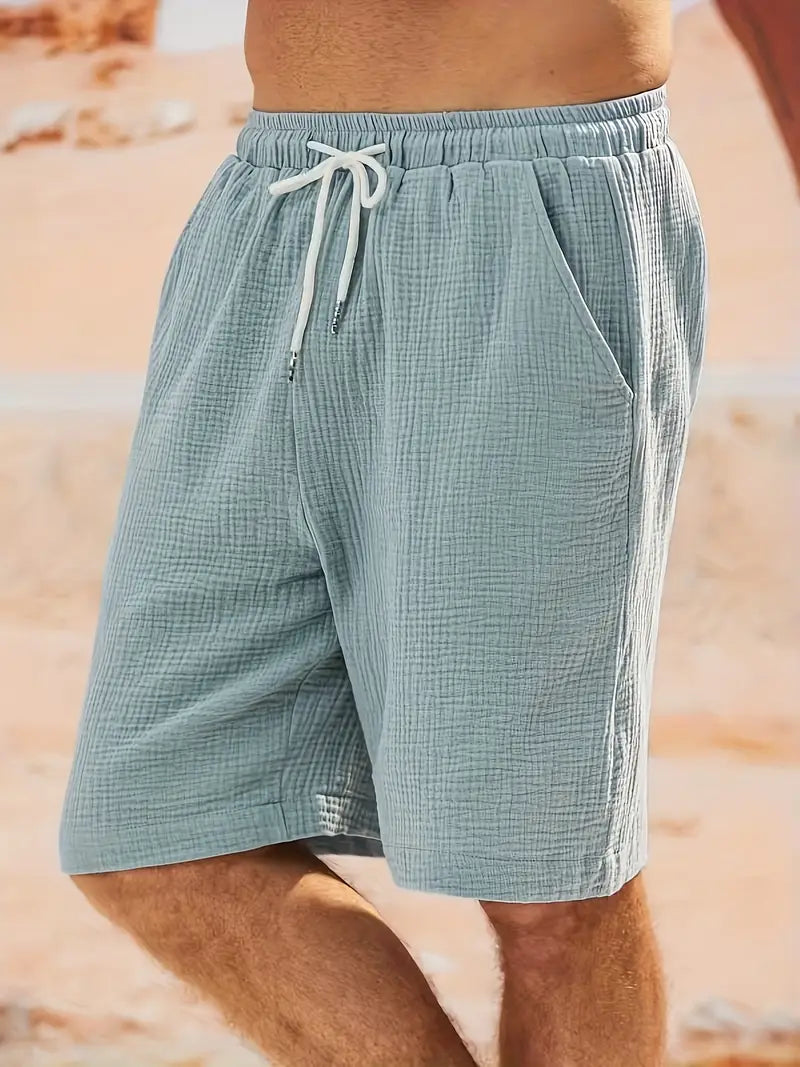 "Shorts décontractés homme, tissu léger, couleurs estivales variées, idéal pour la plage ou les barbecues d'été."