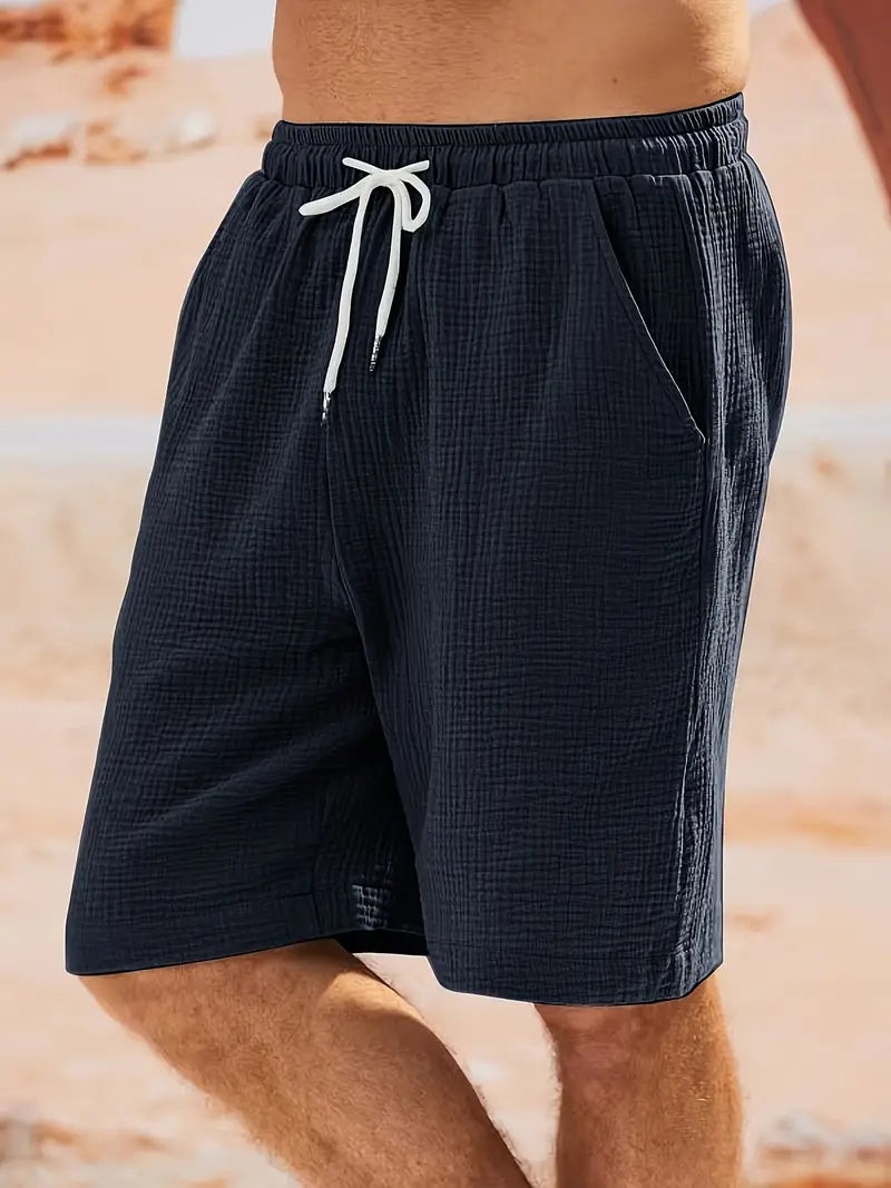 "Shorts décontractés homme, tissu léger, couleurs estivales variées, idéal pour la plage ou les barbecues d'été."