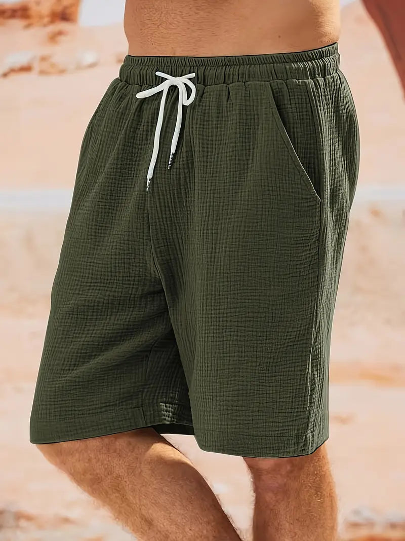 "Shorts décontractés homme, tissu léger, couleurs estivales variées, idéal pour la plage ou les barbecues d'été."