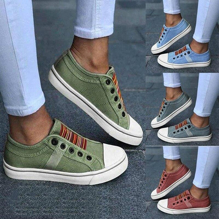 "sneakers basses femme en toile grise élégantes et confortables, design minimaliste, semelle plate, style chic et moderne"