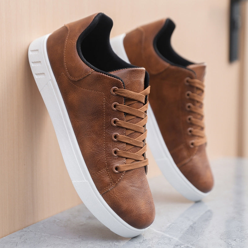 Sneakers homme élégantes et confortables, design minimaliste, couleur sobre, matériaux haute qualité, semelle antidérapante.