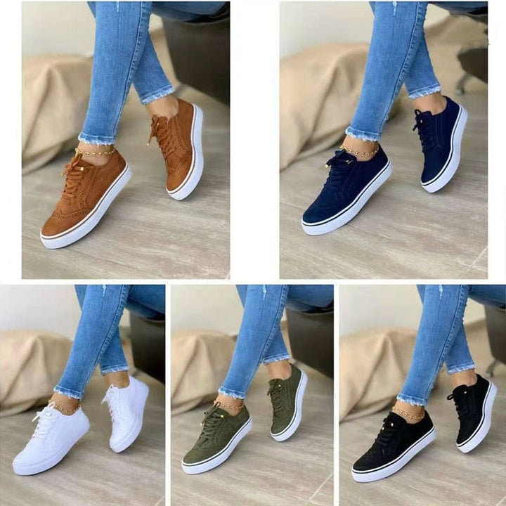 Sneakers orthopédiques élégantes pour femme en cuir blanc, avec semelle de soutien confortable et design moderne.