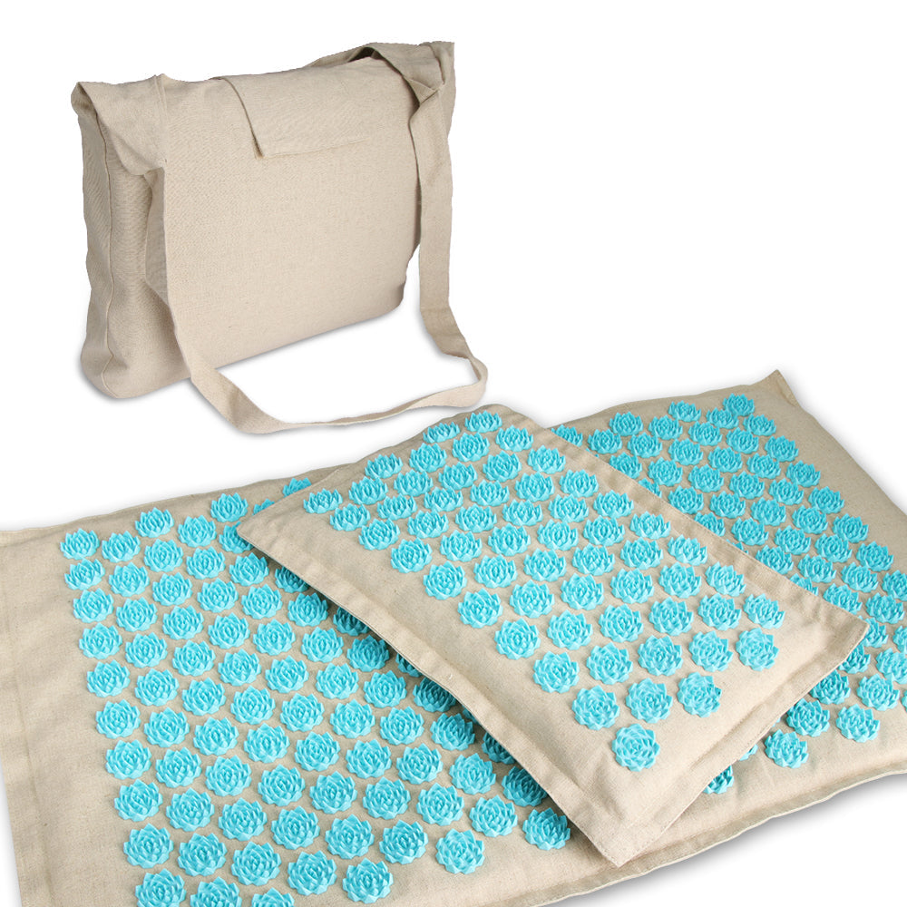 "Tapis d’acupression vert avec oreiller plat, picots blancs pour relaxation, soulagement muscles dos et cervicales."