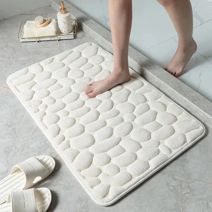 "Tapis de bain anti-dérapant GaletConfort, design galets, blanc, confort moelleux et ultra-absorbant, 40x60 cm."