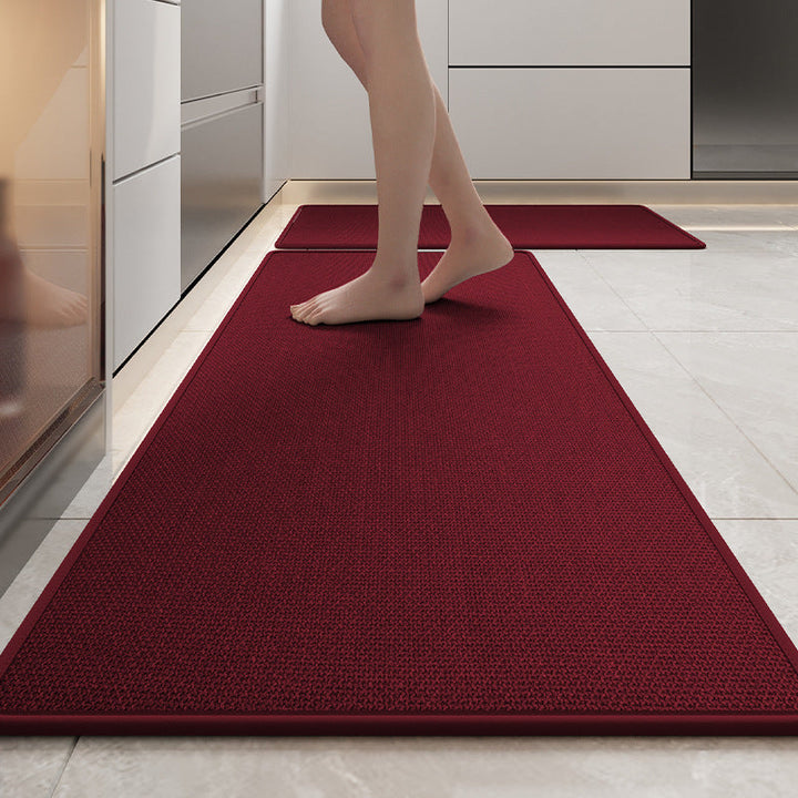 "Tapis de cuisine en lin tressé, antidérapant, couleur gris, sur sol de cuisine, offre confort et sécurité."