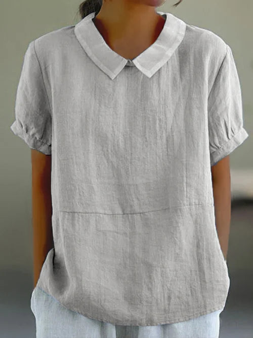 "Top en coton lin uni, léger et épuré, pour femme. Confort respirant, coupe élégante pour un look décontracté chic."