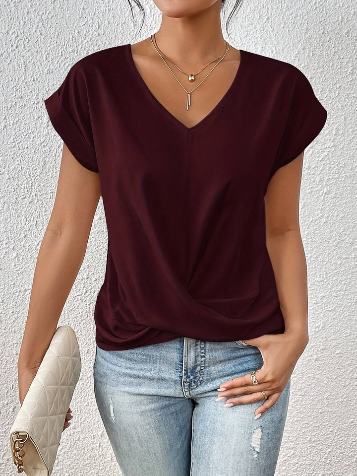 Top femme drapé avec col V, détail de nœud élégant, tissu doux, silhouette flatteuse, bleu profond.