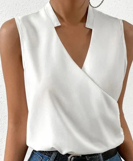 "Top sans manches élégant, tissu haut de gamme, coupe cintrée, coloris uni pour style raffiné et polyvalent."