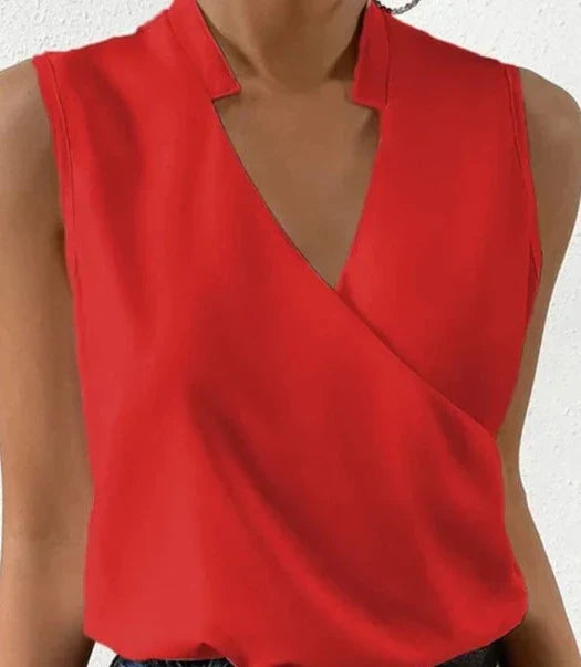 "Top sans manches élégant, tissu haut de gamme, coupe cintrée, coloris uni pour style raffiné et polyvalent."