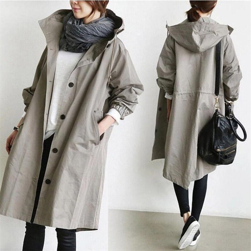 "Trench imperméable à capuche pour femme, coupe élégante, couleur noire, détails raffinés idéal pour saisons pluvieuses."