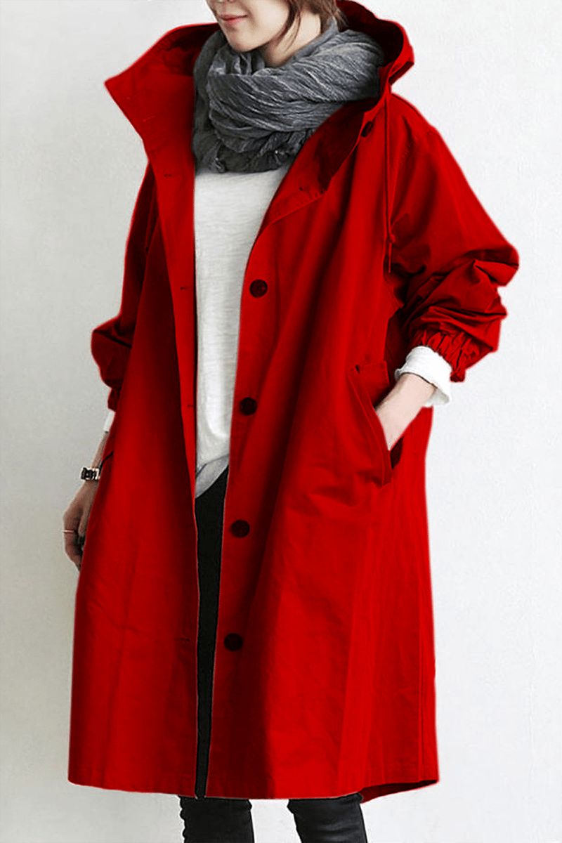 "Trench imperméable à capuche pour femme, coupe élégante, couleur noire, détails raffinés idéal pour saisons pluvieuses."