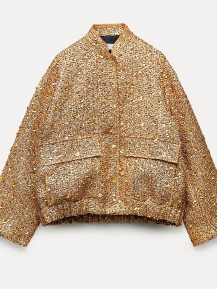 "Veste bomber femme dorée, moderne et ajustée, détails côtelés, idéale pour soirées et occasions spéciales."