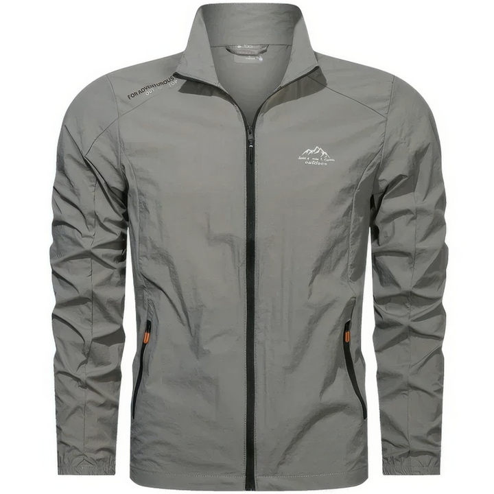 "Veste d'été coupe-vent homme légère, anti-UV, bleue avec poches zippées, idéale pour randonnée et plein air."