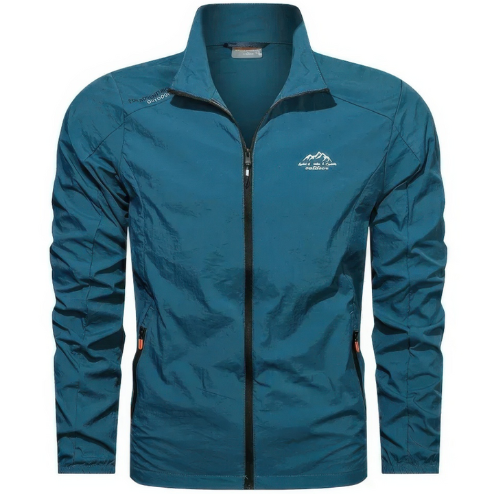 "Veste d'été coupe-vent homme légère, anti-UV, bleue avec poches zippées, idéale pour randonnée et plein air."