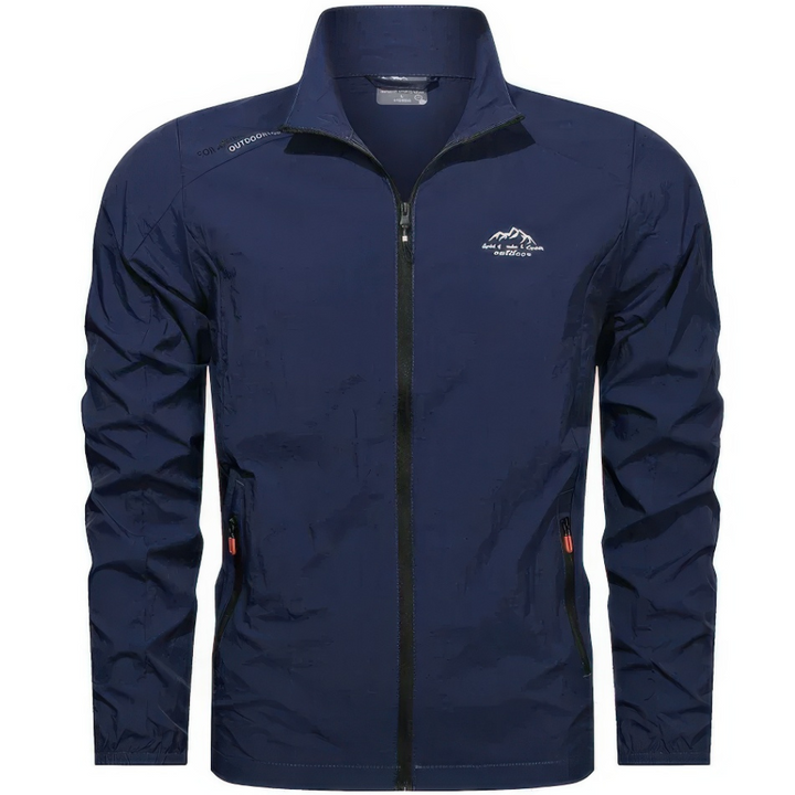 "Veste d'été coupe-vent homme légère, anti-UV, bleue avec poches zippées, idéale pour randonnée et plein air."