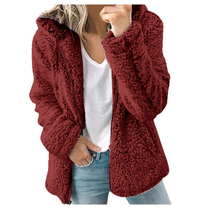 "Veste en peluche femme avec capuche et fermeture éclair, matière fleece douce, style urbain moderne et élégant."