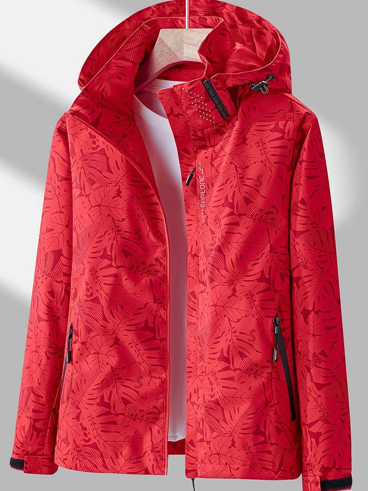 Veste imperméable femme, capuche ajustable, légère, moderne, coloris neutre, idéale pour activités extérieures et urbaines.