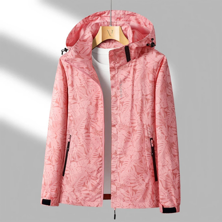 "Veste imperméable Opaline pour femme, légère et coupe-vent, avec capuche intégrée et design moderne."