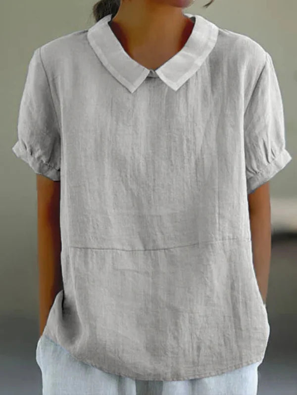 "Vue frontale chic du top unicolore en coton et lin pour femmes, soulignant son élégance et confort."